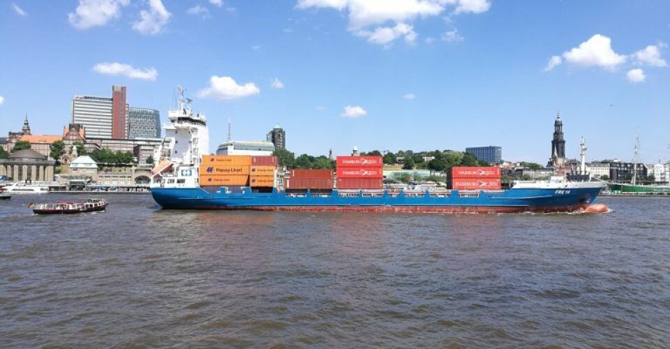 A container ship, heavy duty scaled, in harbor via Wikimedia commons